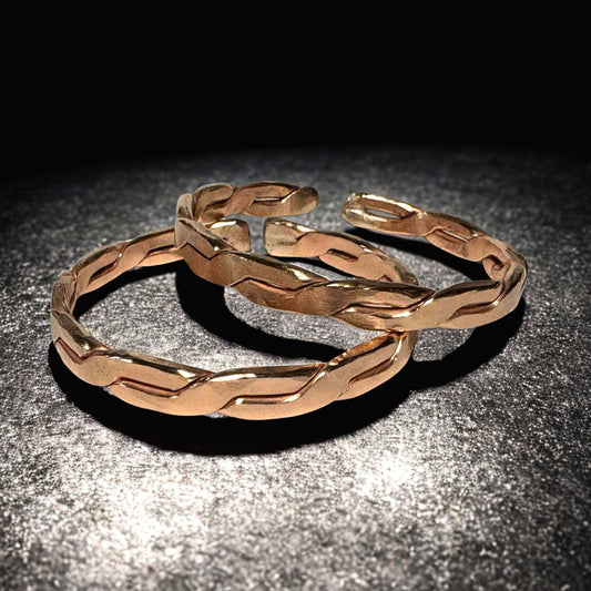 Copper EMF Protection bracelet on a dark textured surface