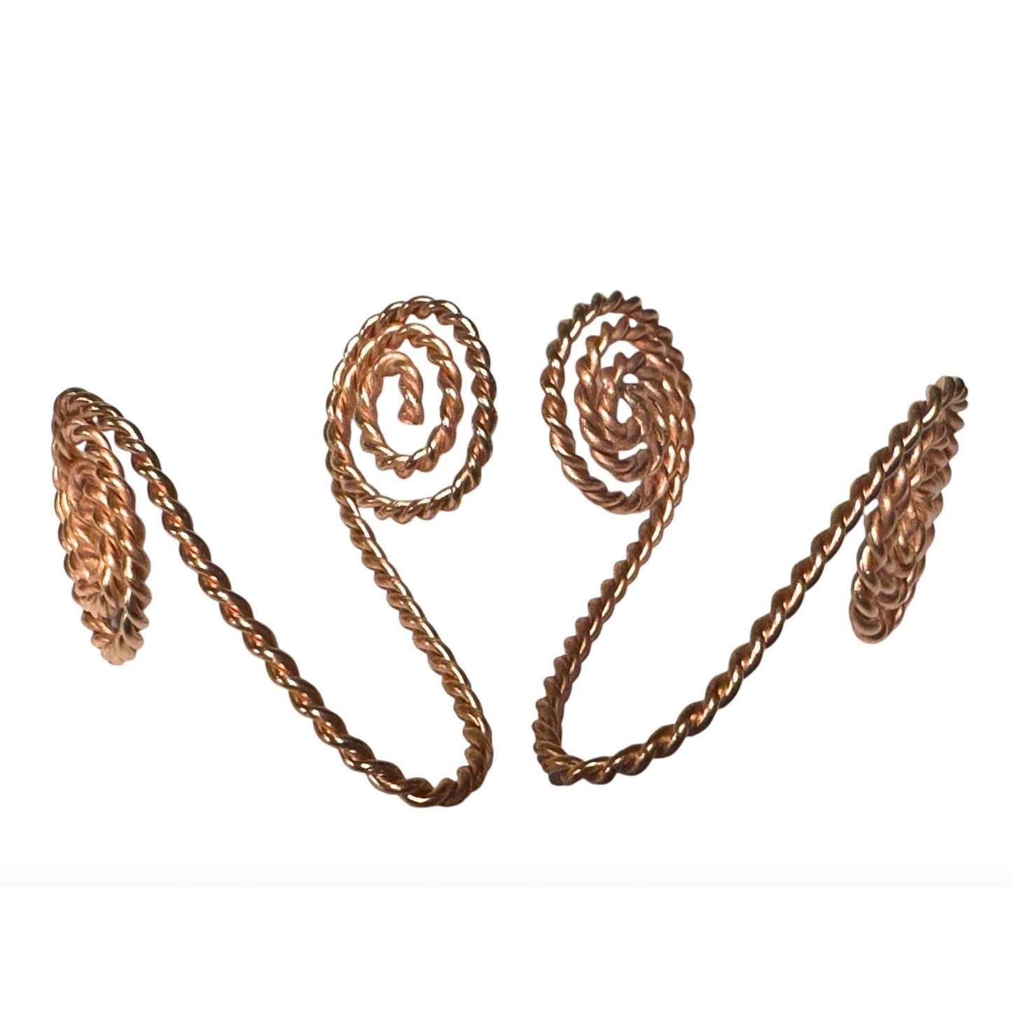 Set of copper spiral EMF hand healing cuffs on a white background
