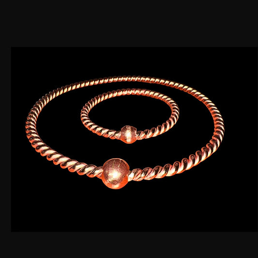 copper ring with bead accents on a black background