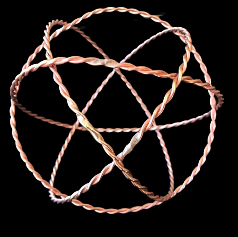 Twisted copper wire on a black background