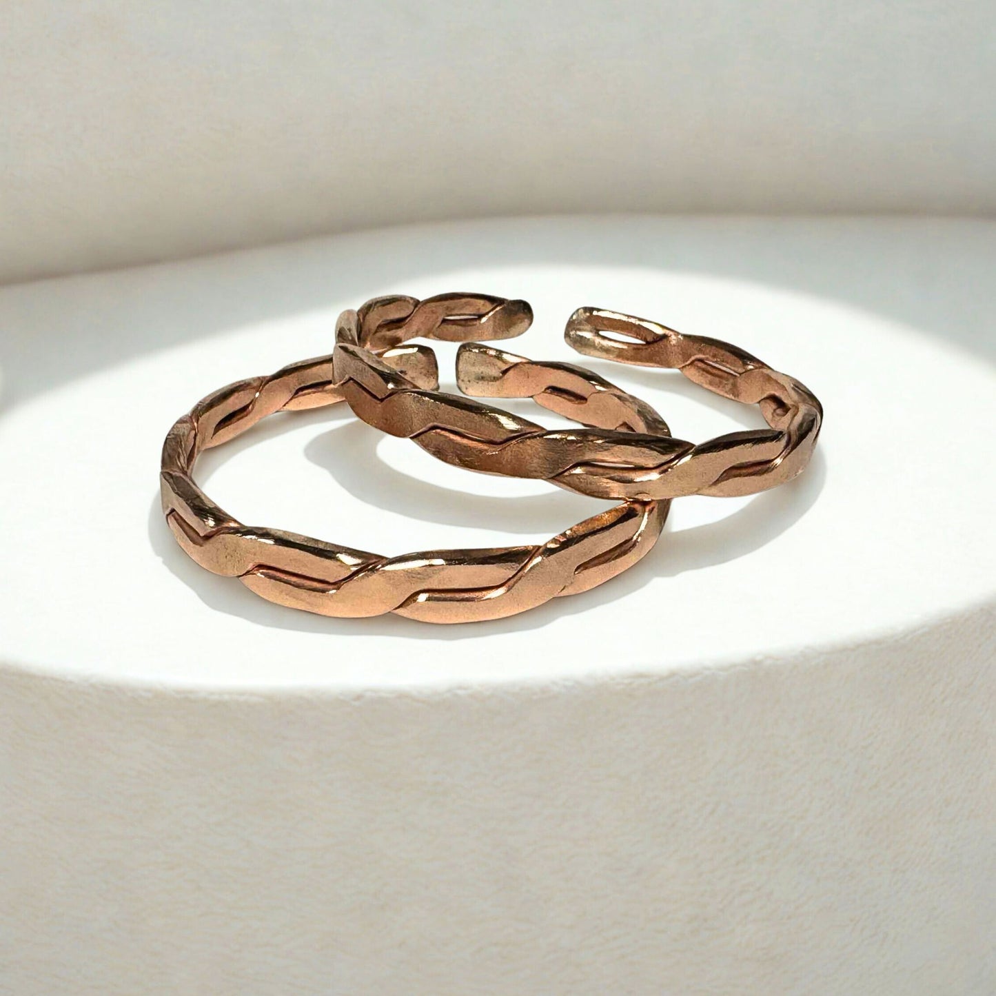 Copper EMF Protection bangles on a light background