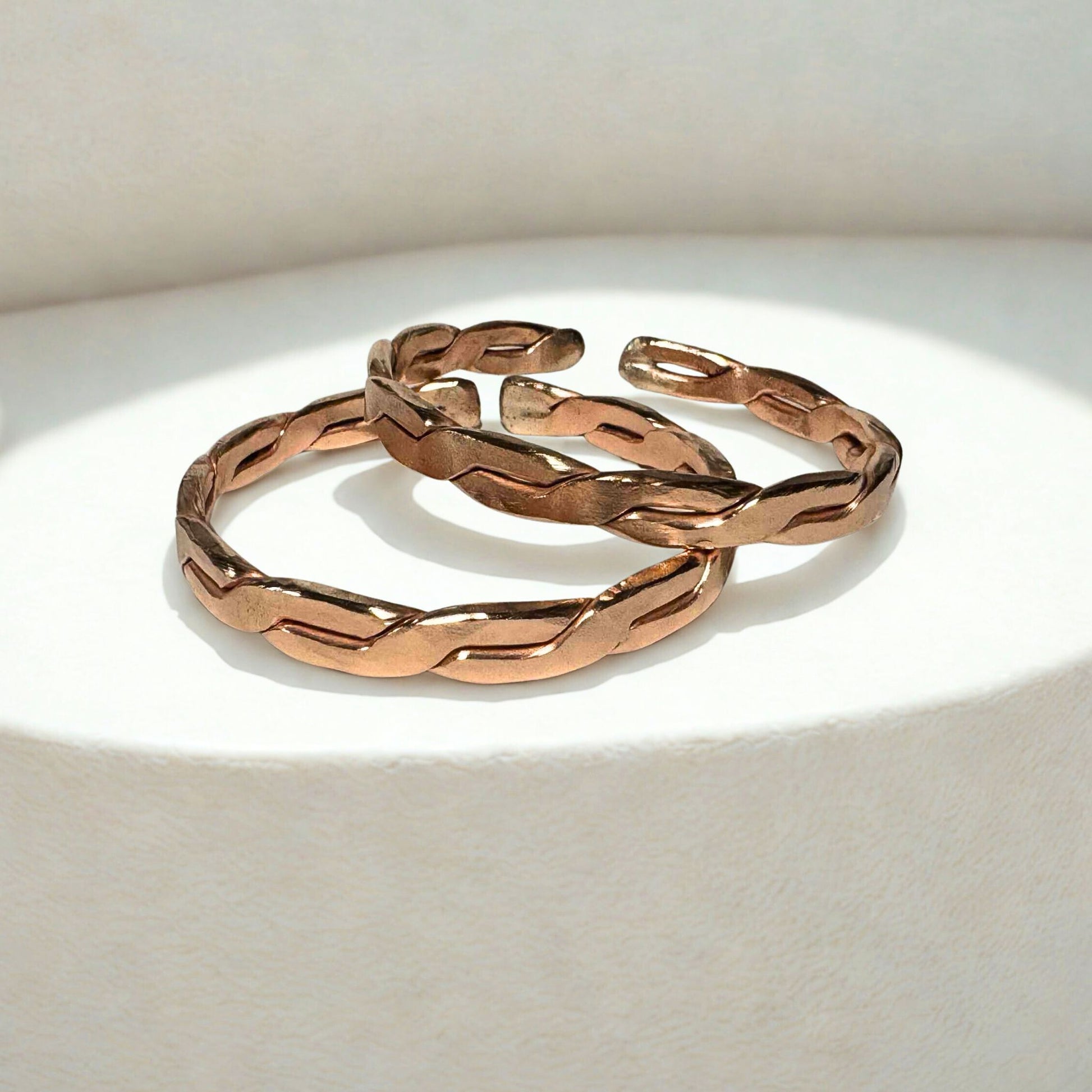 Copper EMF Protection bangles on a light background
