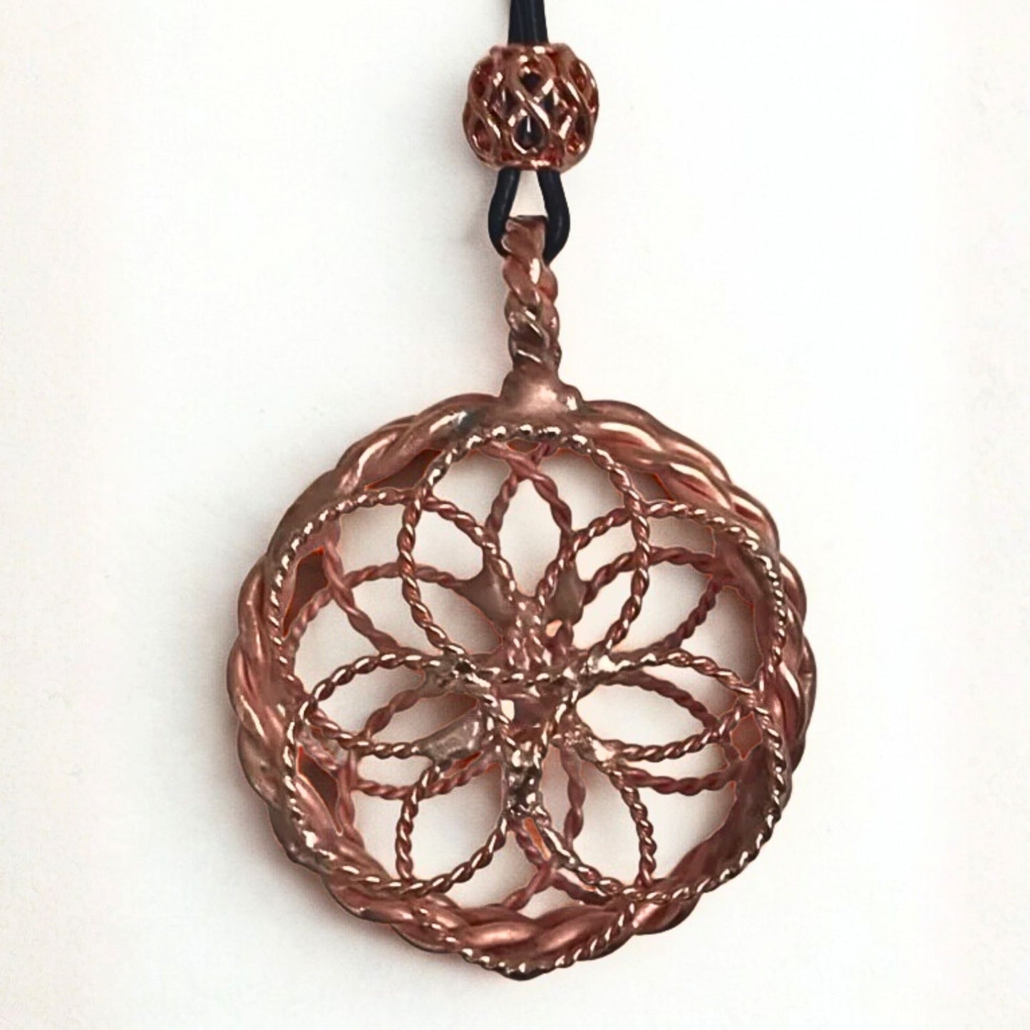 Copper pendant necklace on a white background