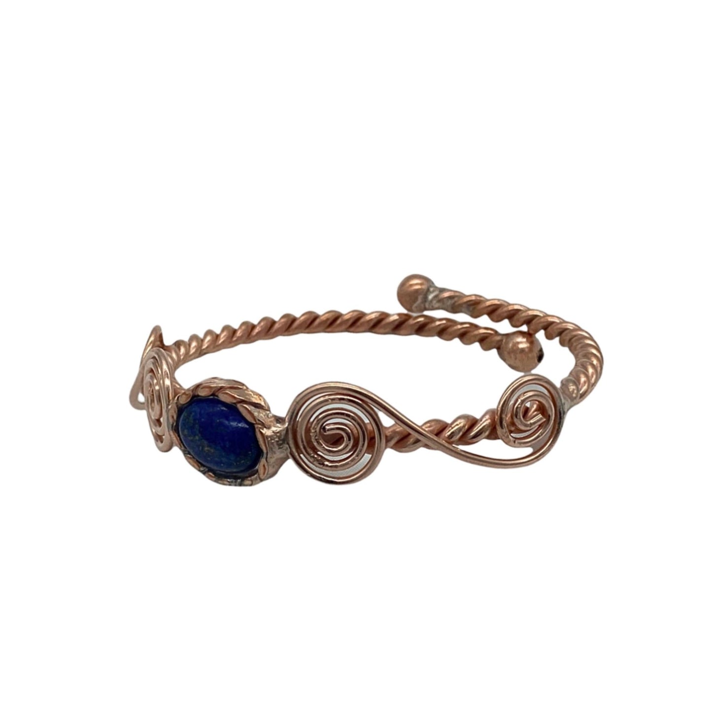 Copper arm wrap  bracelet with a blue stone on a white background