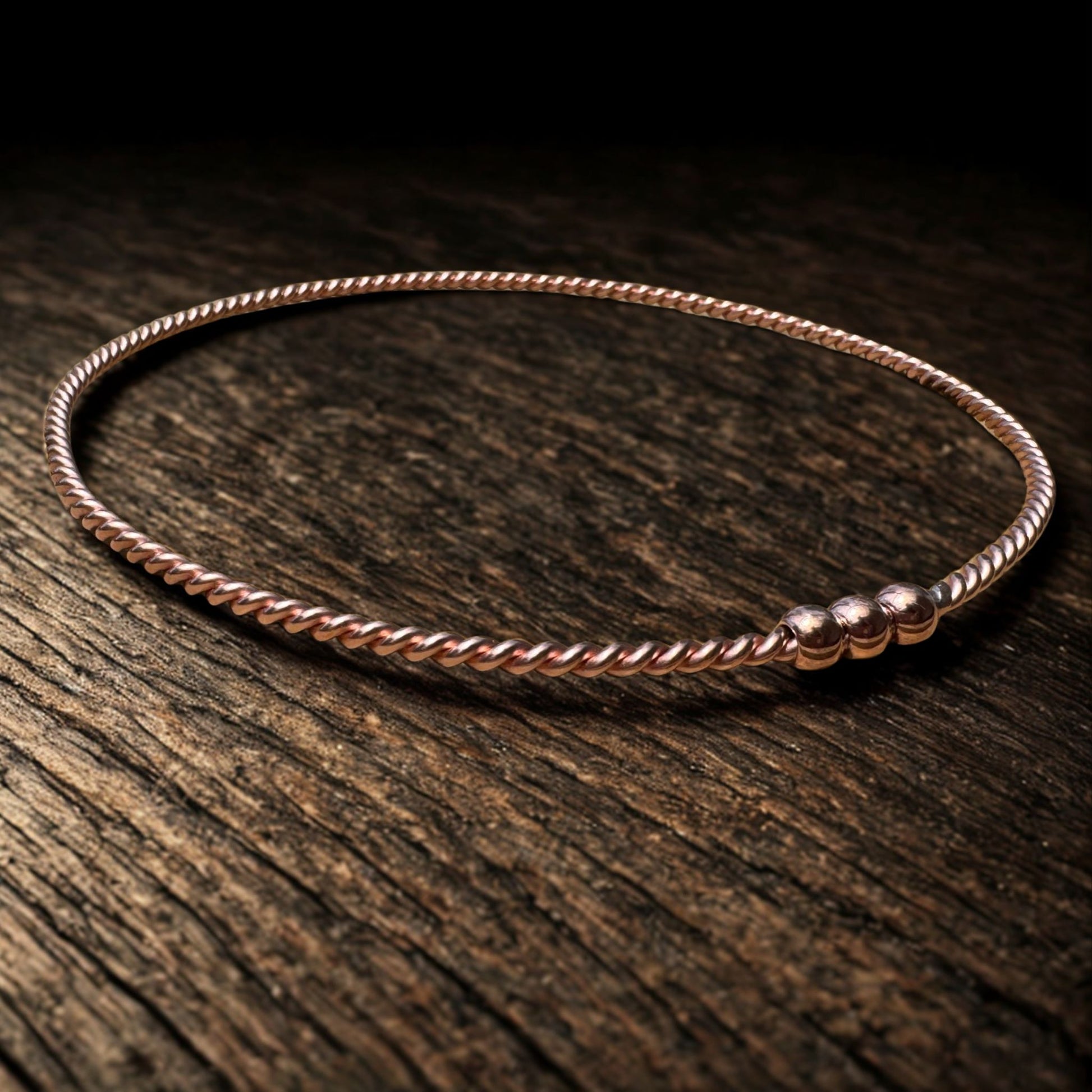  EMF copper ring on a wooden surface